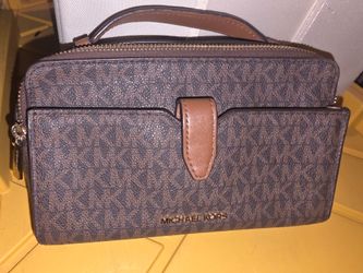 Hi cleaning  my closet im selling my mk purses the blue is 80 and also the others are 45