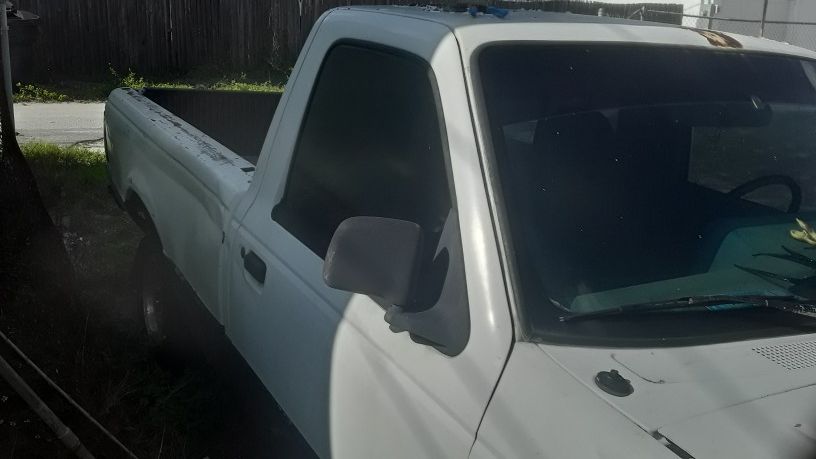 Ford ranger, and rims for parts new alternator,starter fairly new radiator ,does not run but has a good motor and transmission . No title