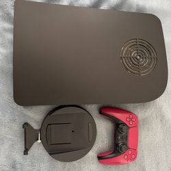 PlayStation 5 Standard Edition with Dbrand Dark Plates.