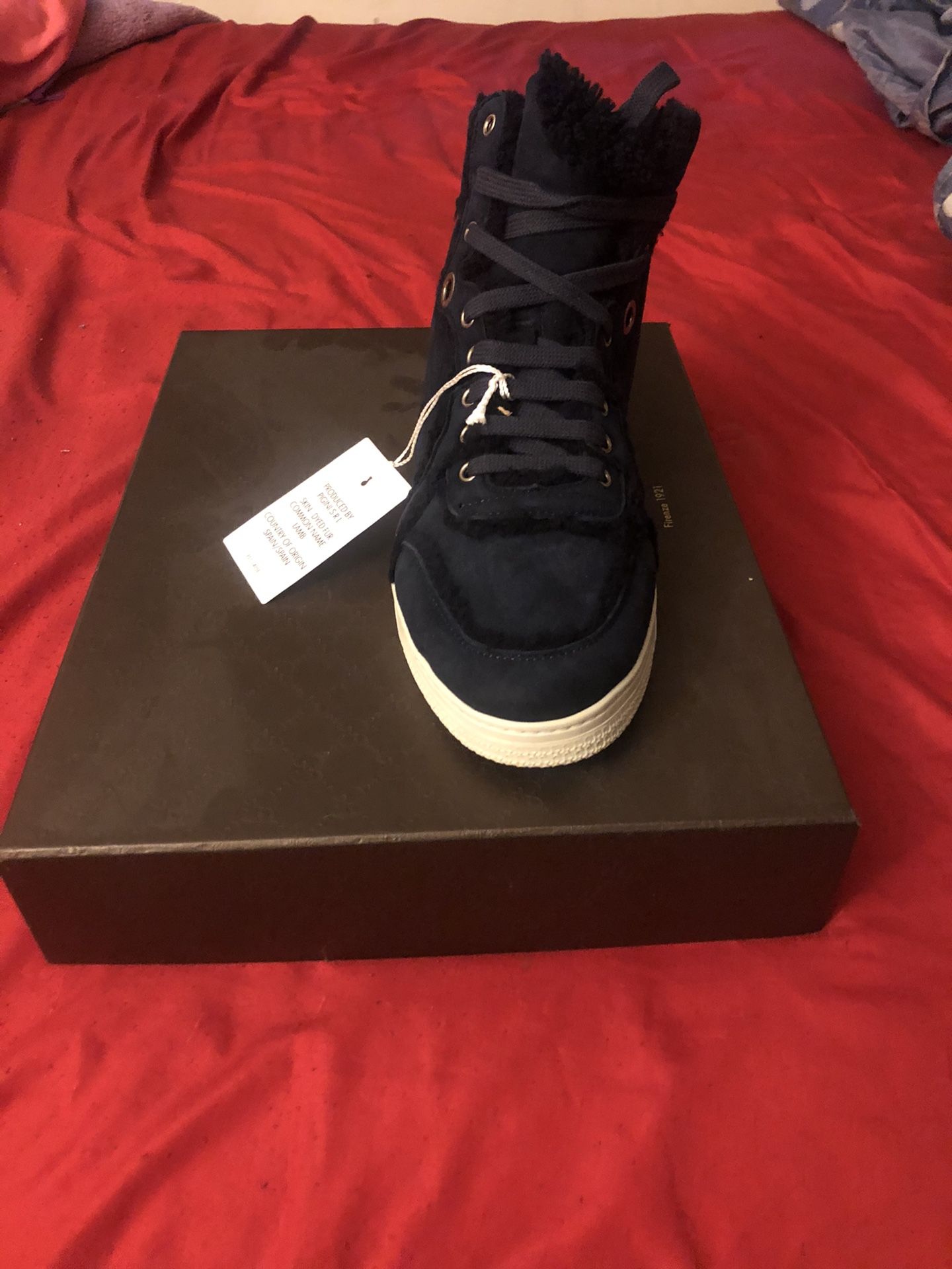 Never worn or even tried on Authentic Gucci high top sneakers size 8. Limited edition and can’t be found in stores. Paperwork from date of purchase a
