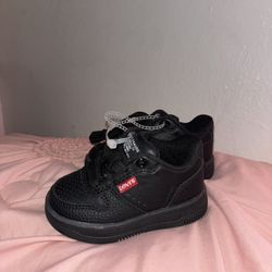 two pairs of toddler shoes