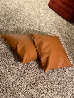 Light brown leather throw pillows