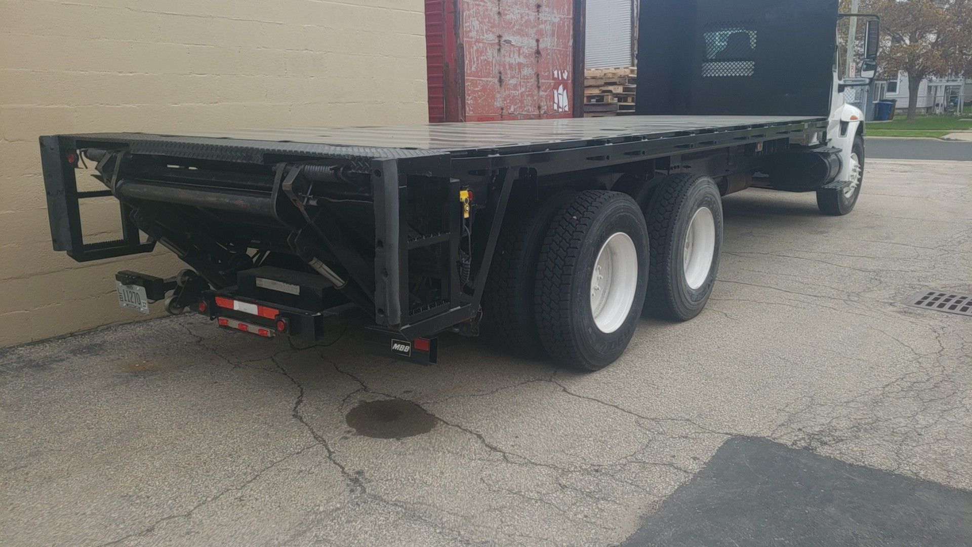 24' x 96" steel flatbed with 3300lb liftgate
