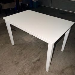 White table with no chairs