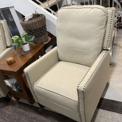 Two small beige recliners ; Overstock listed for $315 each 