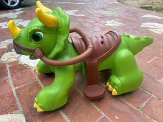 Battery operated green ride on dinosaur