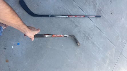 two used hockey sticks