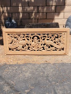 Hand carved wooden panel.