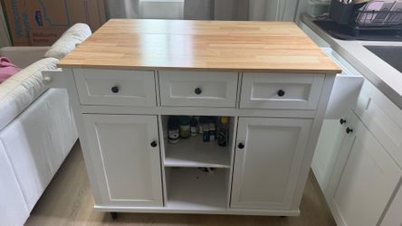 Charming kitchen island on wheels