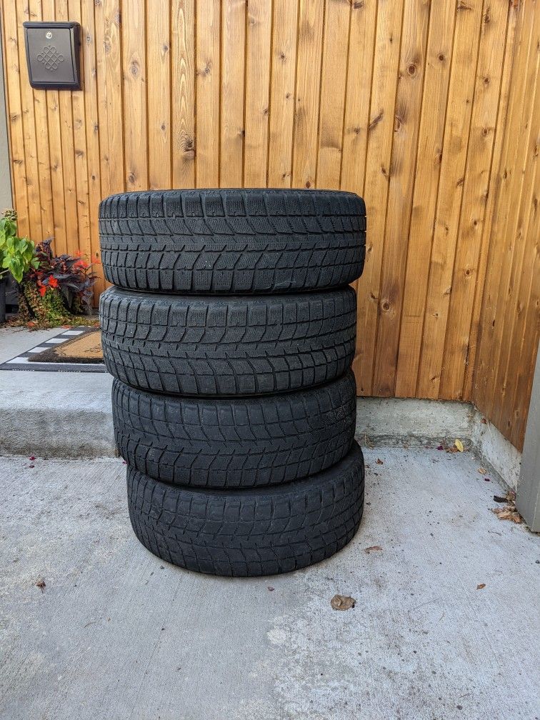 Bridgestone Blizzak WS70 Snow Tires 205/55R16 On Black Steel Rims