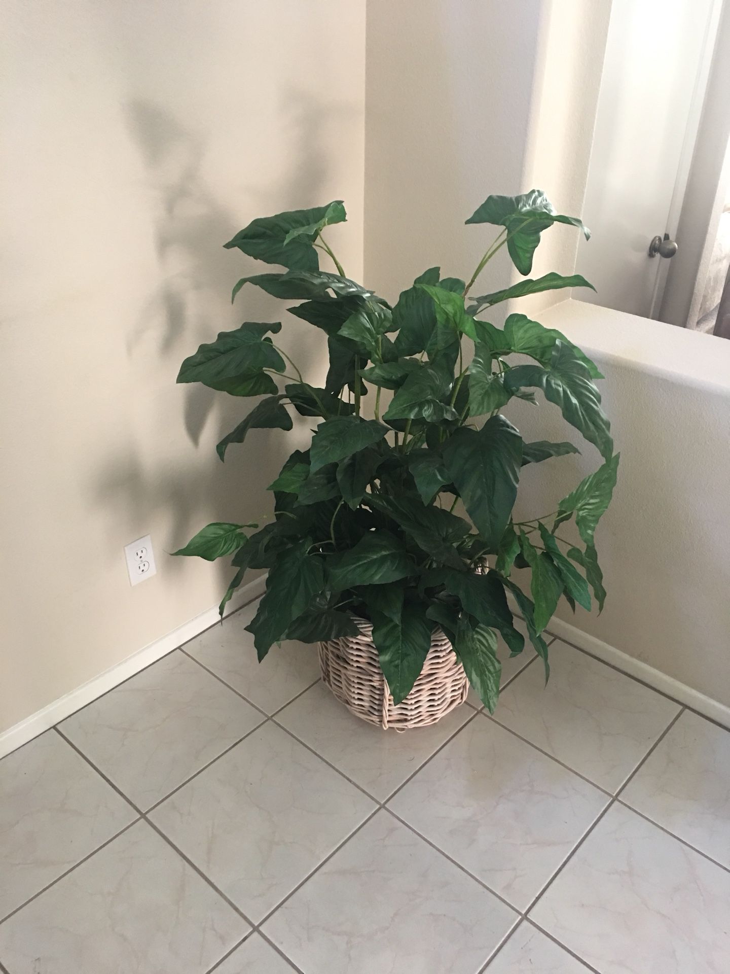 Artificial plant with basket