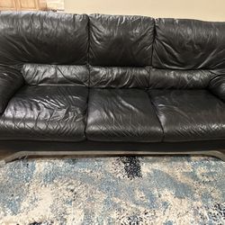 Nicoletti black leather 3 person sofa, club chair and ottoman. 