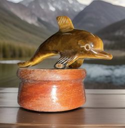Tigers Eye Hand Carved Dolphin Crystals on Stand is a unique and natural collectible