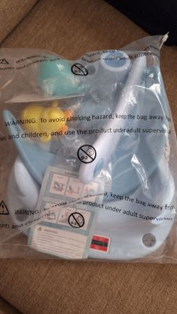 baby bath seat with suction cups and toys. New