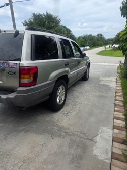 2004 Jeep  Grand  Cherokee -  Gold, Charcoal interior