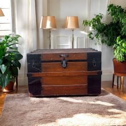 Antique Steamer Trunk On Wheels