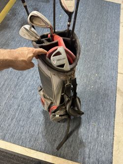 Zevo titanium matrix golf clubs with carry bag.