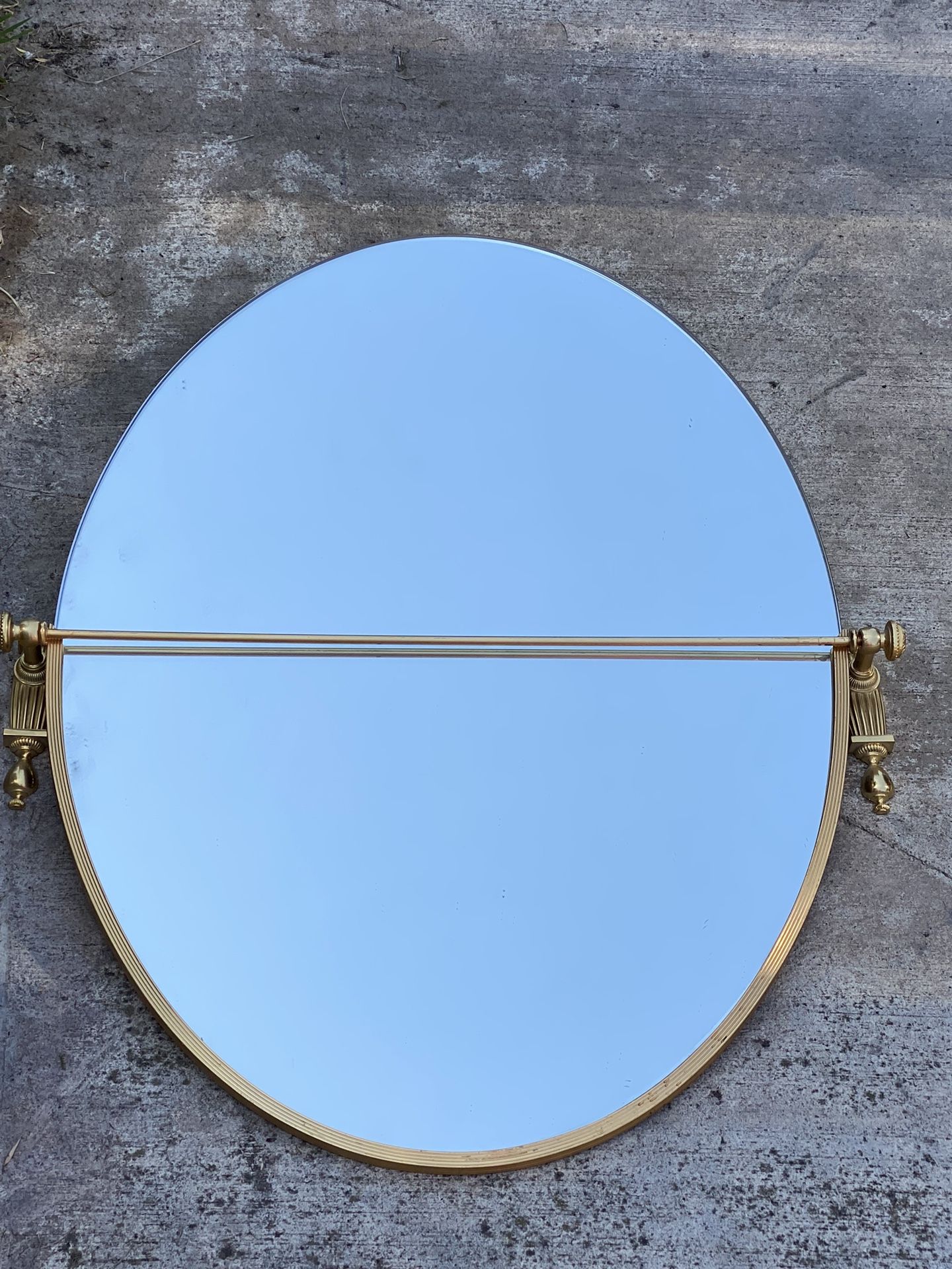 Gold oval wall mirror