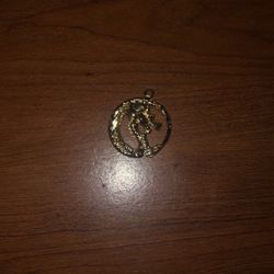Gold dragon pendant