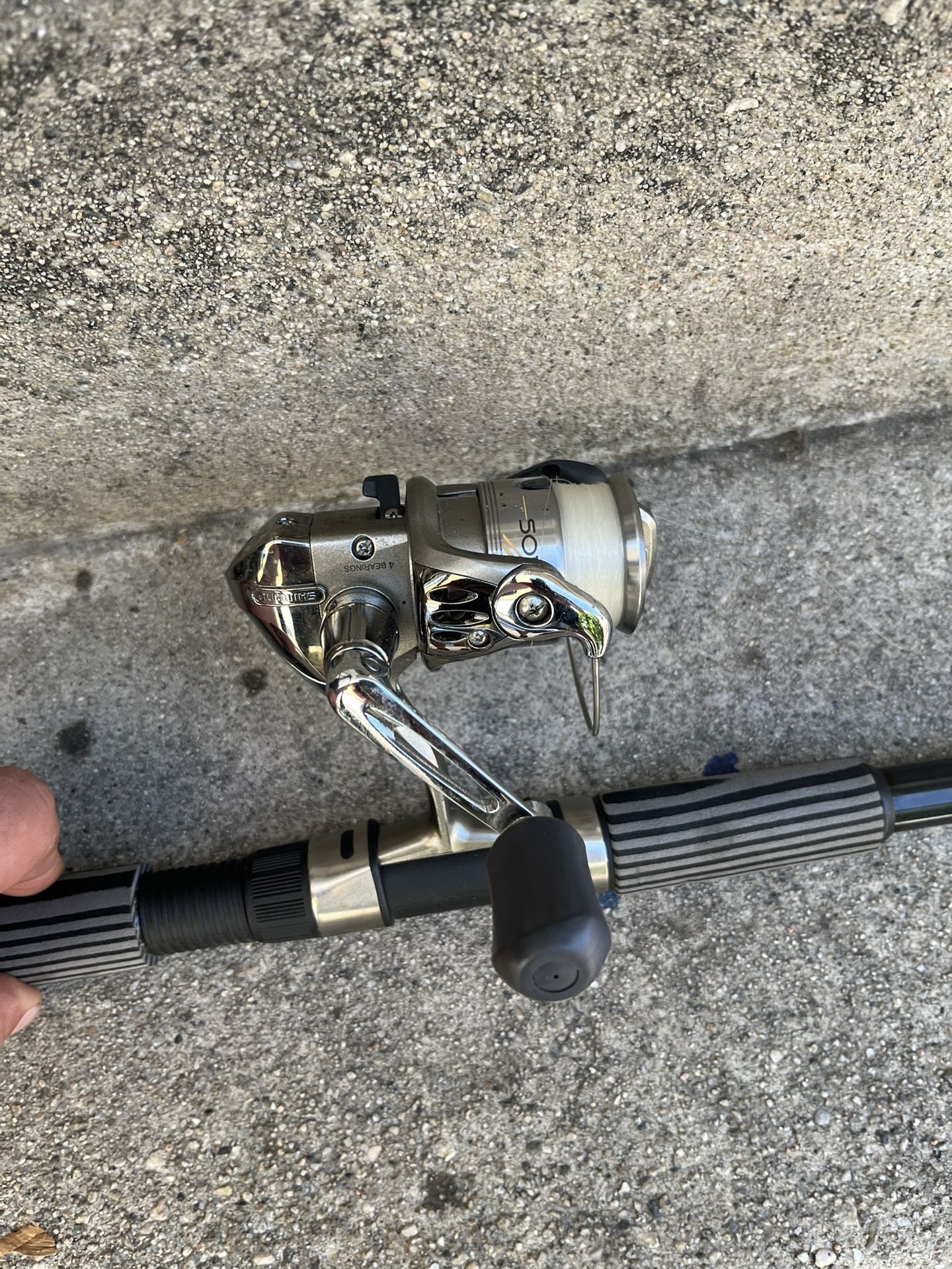Two telescoping fishing rods and a reel price is for the lot
