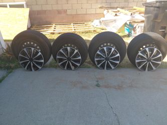 Tires with rims  2 Firestone, and 2 westlake