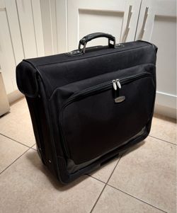 Dockers brand black travel garment bag designed with wheels for mobility