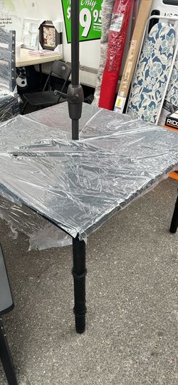 Outdoor table with umbrella