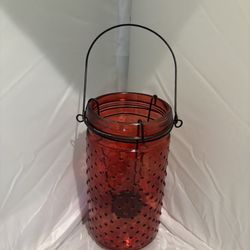 This product is a red glass hobnail vase