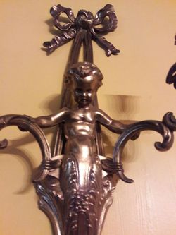 2 solid iron Cherub candle holders 22" L x 12"w