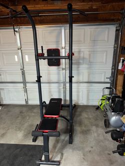 Weight bench, pull up bar power tower bench press, and rowing machine