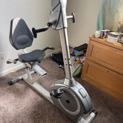 Seated spin bike w/ Upper body spinning option