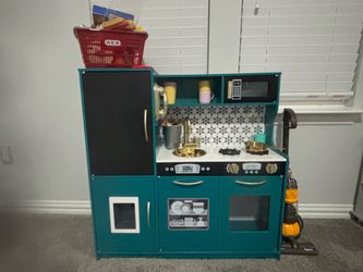 Very nice teal kitchen.