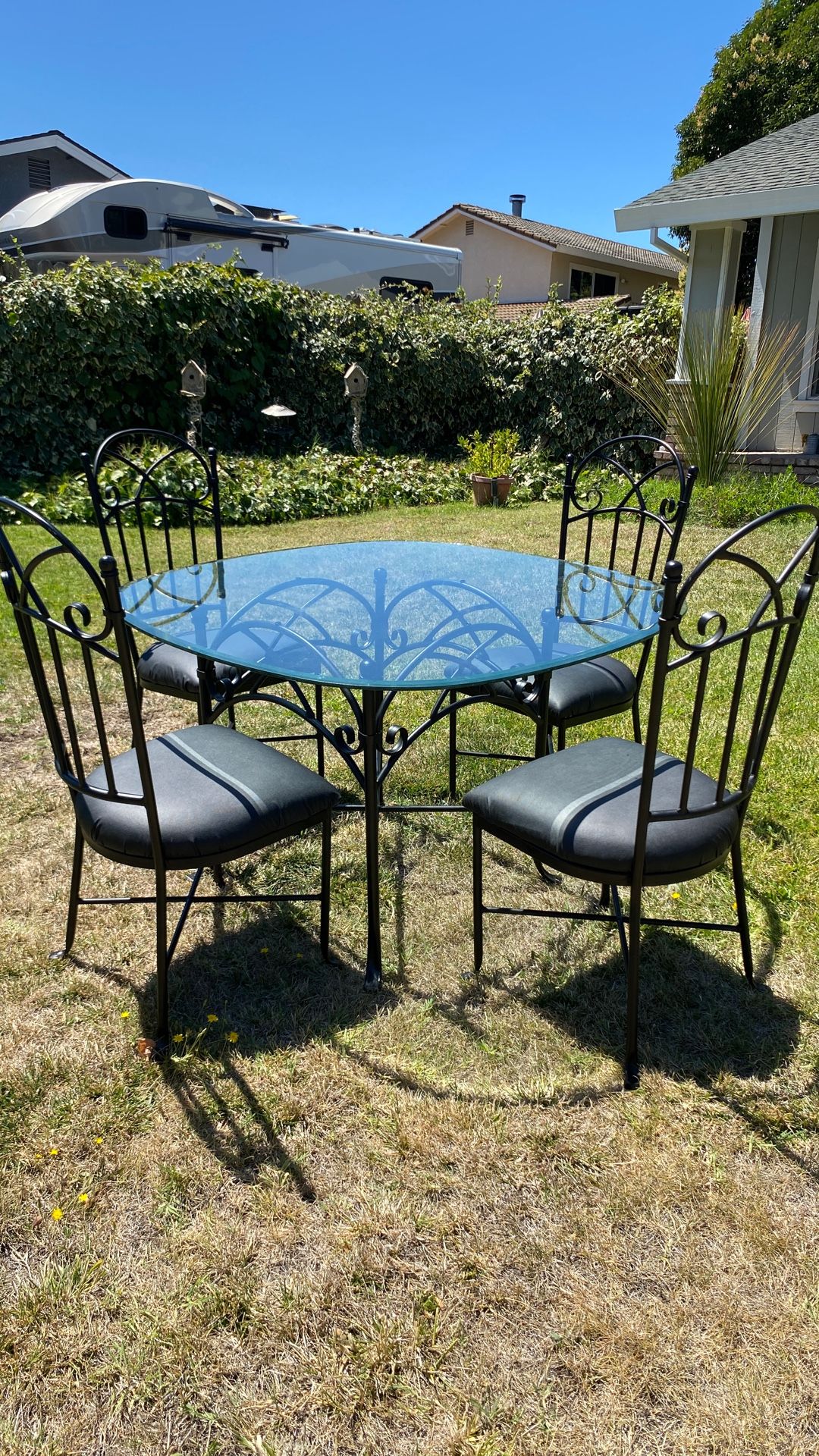 Iron Table With Glass top  And 4 Chairs.