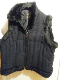 Black vest with fur on collar and at the botton