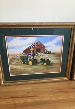 Beautiful framed print of little boy on John Deere tractor pulling wagon full of puppies on farm