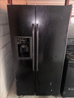 Black GE Refrigerator And Freezer