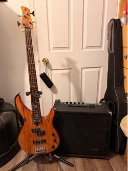 Yamaha mang wood 4 string electric bass guitar bundled with stagg 60 BA
