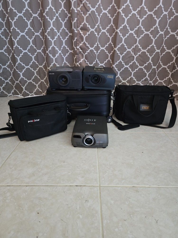 3 Working Projectors With Cases And Cabels Need. $60 FIRM!
