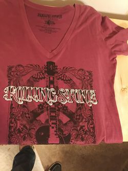 Vintage Rolling Stone Collection Tshirt in raspberry with black and white for lettering on top of a floral guitar motif in the back