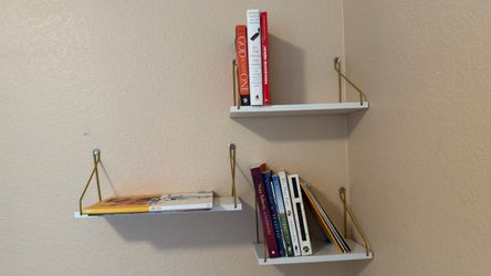 White Floating Wall Shelves with Gold Brackets