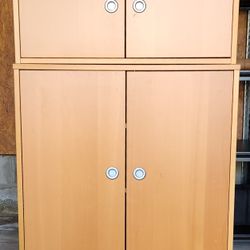 1 owner matching Ikea floor standing and wall mount oak color cabinets with 2 doors each.