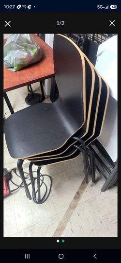 4 Stackable black dinning chairs withsteel legs