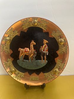 vintage 11.5” metal handcrafted Peruvian repoussé copper and brass decorative wall