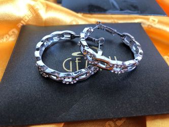 Different Styles Of Silver Ear Rings And Rings For Women Or Couple