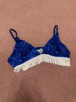 Sparkling blue sequin bralette with playful sequin white fringe along the hem. Adjustable straps for a comfortable fit. Lightweight and designed for s