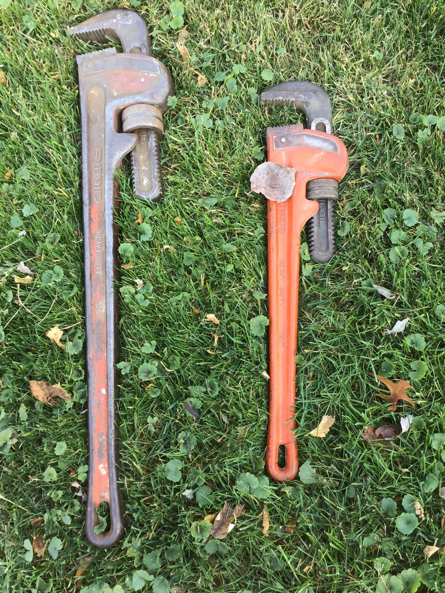 Two Ridged pipe wrenches, one is 18 inches one is 24 inches