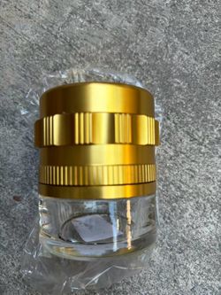 Spice Grinder. 2.5 inch herb grinder with jar attached. Jar offers a larger storage capacity. Anodized Aluminum alloy with glass bottom. (2.5 Inches x