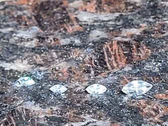 One carat markey cut diamond, 1/2 carat marquee , cut diamond and,1/8 carat marquee cut diamonds