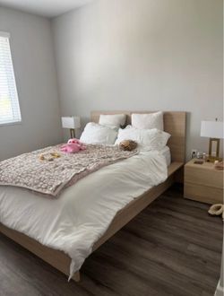 Wooden bed with two nightstands