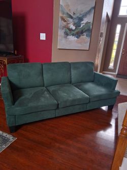 2 green couches in good shape